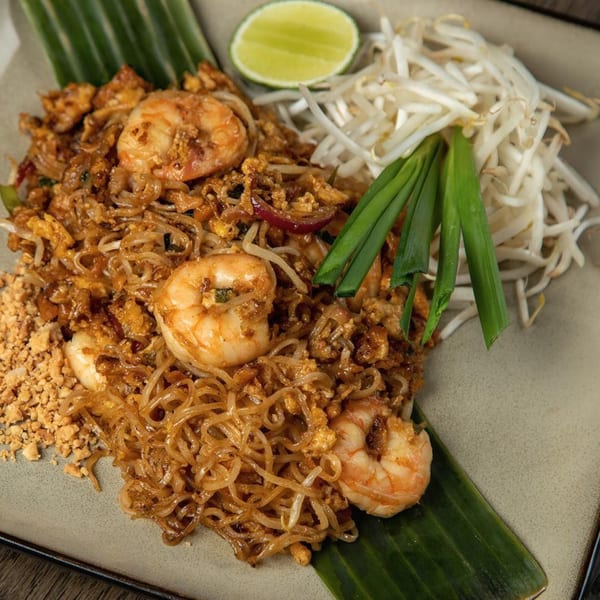 Bai Tong Thai Restaurant's Pad Thai with shrimp, bean sprouts, lime, and crushed peanuts.